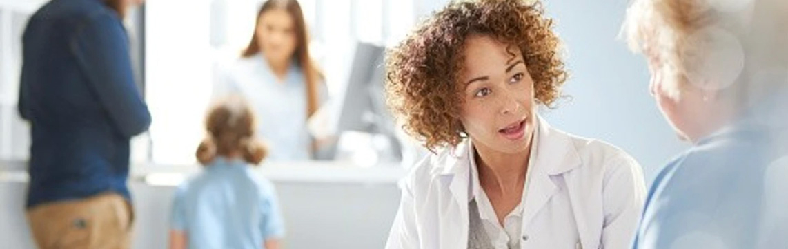 Clinician talks with patients